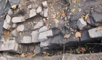 #1: Excavated foundation stones with possible opening for cellar stairs