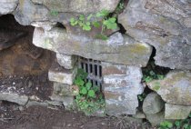 #10, photo 6744: deteriorated north vault wall and grilled vent