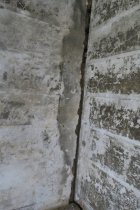 #4: Unrestored plaster and shelving "ghosts" in back parlor