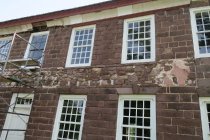 #1: Façade cove cornice prior to restoration