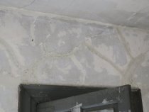 #8: Filled-in plaster cracks feathered to ambient wall plane