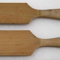 Two wooden butter paddles