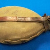 Oval shaped metal canteen with cover