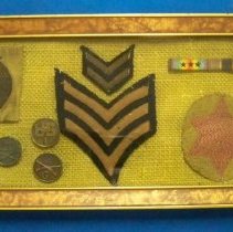 Framed U. S. Army insignia & buttons