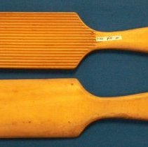 Two wooden butter paddles