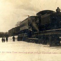 First train on Luce Line over bridge at Winsted Lake