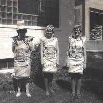 3 women in costumes