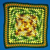 Crocheted granny square pillow cover