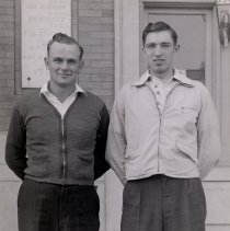 2 men standing in front of McLeod County Courthouse