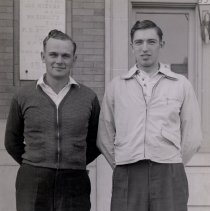 2 men standing in front of McLeod Coounty Courthouse
