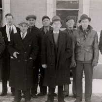 9 men standing outside McLeod County Courthouse