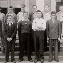 12 men standing outside McLeod County Courthouse