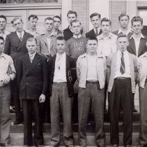 17 young men standing outside the McLeod County Courthouse