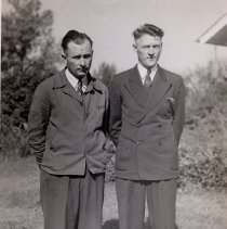 2 men standing outdoors