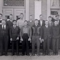 16 men standing outside McLeod County Courthouse