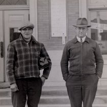 2 men standing outside McLeod County Courthouse