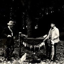 Men with large string of fish