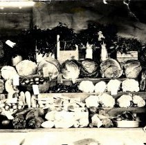 Andrew Anderson standing near display of vegetables