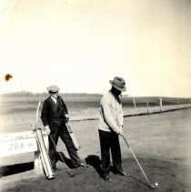 Men playing golf