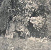 Eunice Gaines with uprooted tree at Lake Marion after 1952 tornado