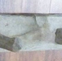 Wooden hooks/pegs on a wooden plank