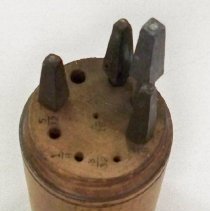 Wooden round case with 4 drill bits