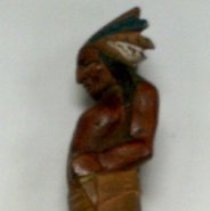 Wood carving of a large knife with handle