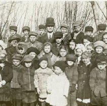 A group of unidentified children and 1 male adult