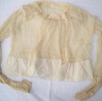 Sheer ivory colored long sleeve blouse