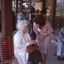 1979 Hutch Water Carnival/candidate Laurie Yerks visiting with spectator