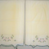 Pair of white pillowcases with blue trim