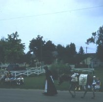 1957 Brownton, MN centennial parade/woman & donkey