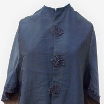 Black cotton cape with black seed bead trim