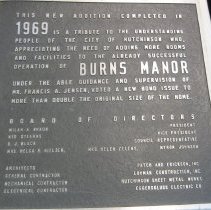 Heavy metal sign for Burns Manor addition
