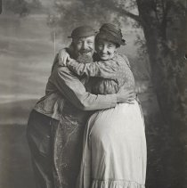 Unidentified couple in costumes & hats