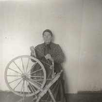 Unidentified woman at spinning wheel