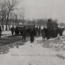 Laying steel rails west of Winsted bridge