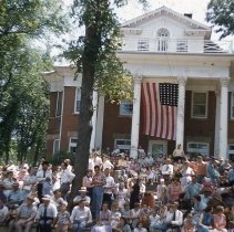 Crowd of spectators in front of Quast house, Hutchinson, MN