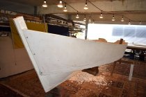 The V-bow on this 20-foot commercial fishing skiff is shaped with a chunk f