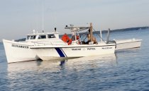 Marine patrol checking the oyster harvest