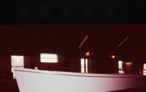 Side view of 22' wooden skiff