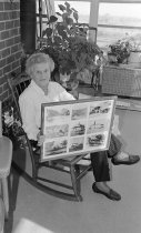 Mrs. Cody Dowell at home with a photo montage, 1993