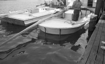 Two oyster tonging boats with different sterns