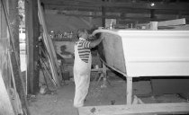 Willard Norris working on the stern of a new deadrise workboat
