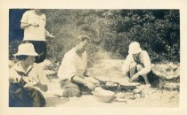 Capt. Bill frying blue berry [sic] flap-jacks at Gull Pond., Camp Chequesse