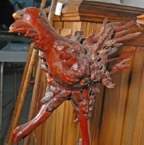 Bird figure of the Sculpture (to the left of Li)