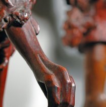 Bird figure's claw area (raised foot)