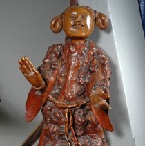 Attendant figure (apprentice?) to right of Li