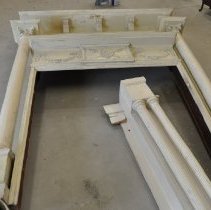 Mantel after brushing, vaccuuming and scraping loose paint - bottom half