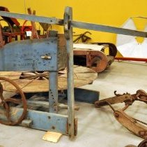 View of exterior from flywheel side and churn handle pump